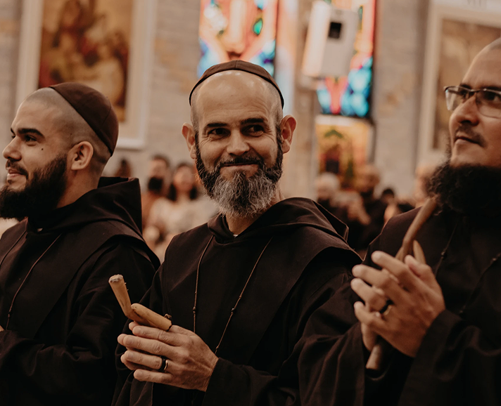 Smiling friars in a church