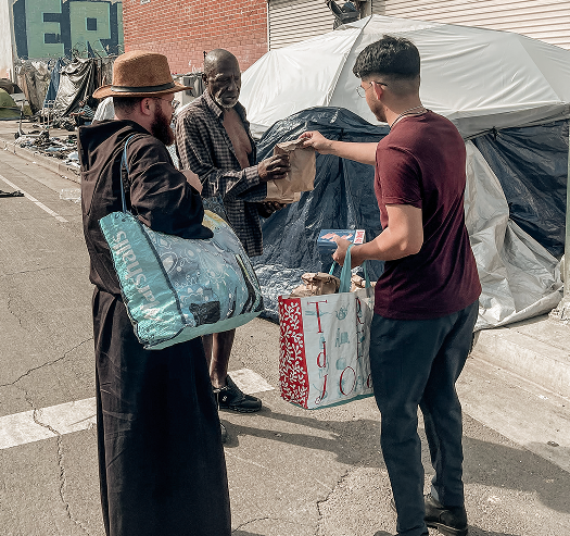 Friars handing out food on the street
