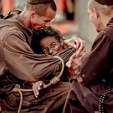 Friar hugging a person with love