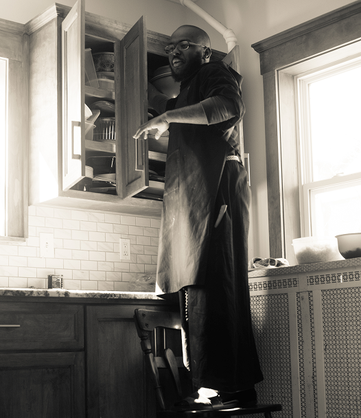 Friar working in the kitchen