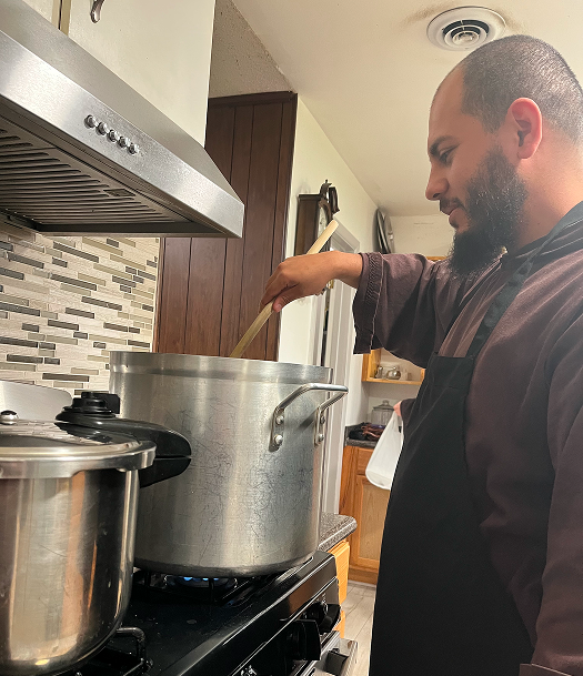 Friar cooking a meal